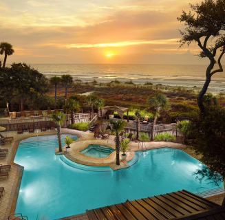 pool with a sunset behind