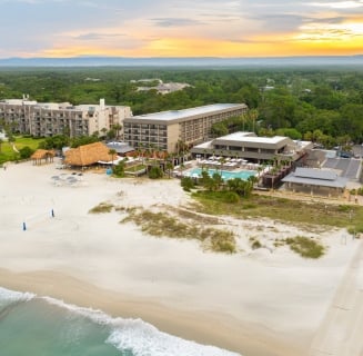 aerial shot of beach house resort and beach