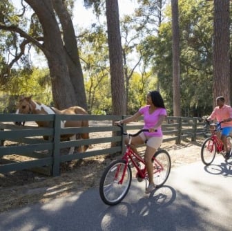 women and man biking