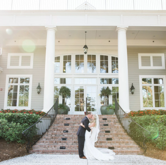 couple embracing in frnt of a building