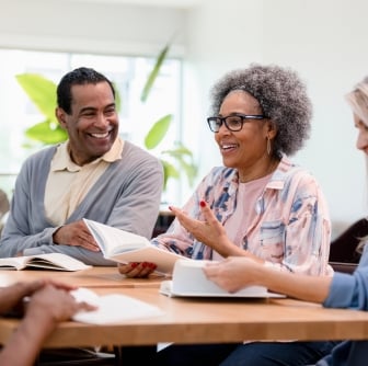 group of people smiling during a meeting