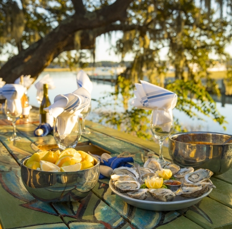 food and wine set on a table outside