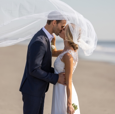 couple kissing on the beach