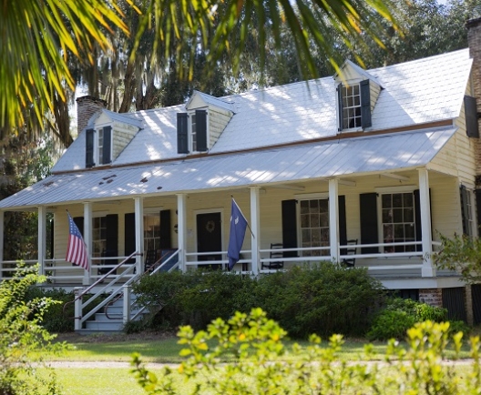Big yellow home with a white porch