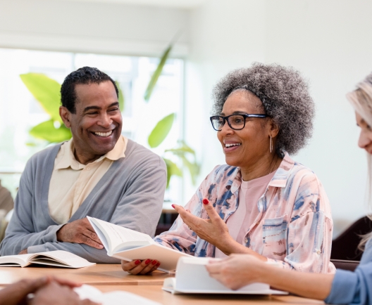 group of people smiling during a meeting