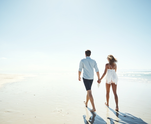 couple walking on a beach