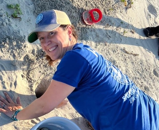 Woman working for Sea Turtle Patrol helping turtle nests 