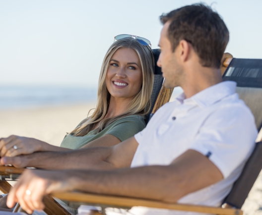 couple sitting on the beach 