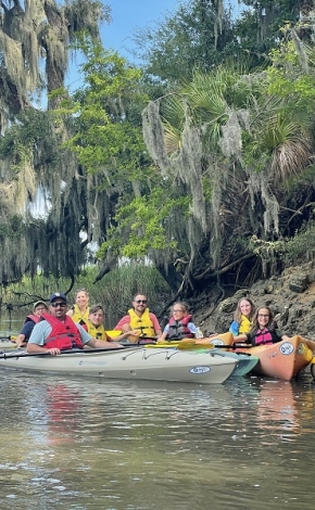 group of people in kayaks