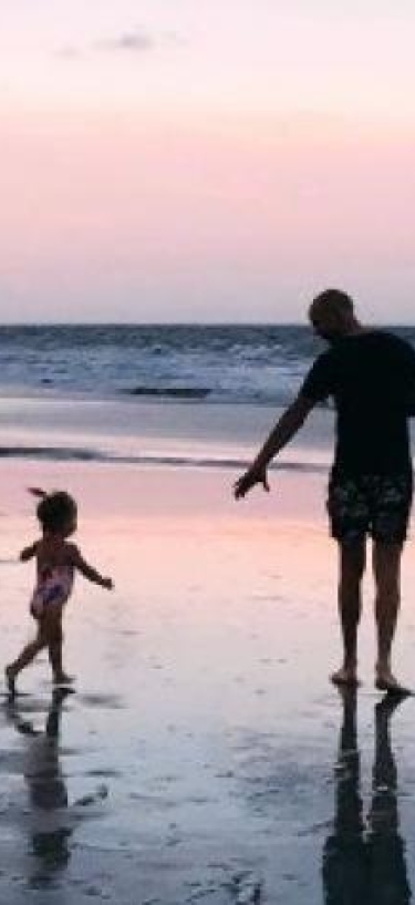 dad with child beach