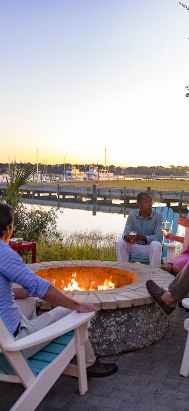 group of people around a firepit