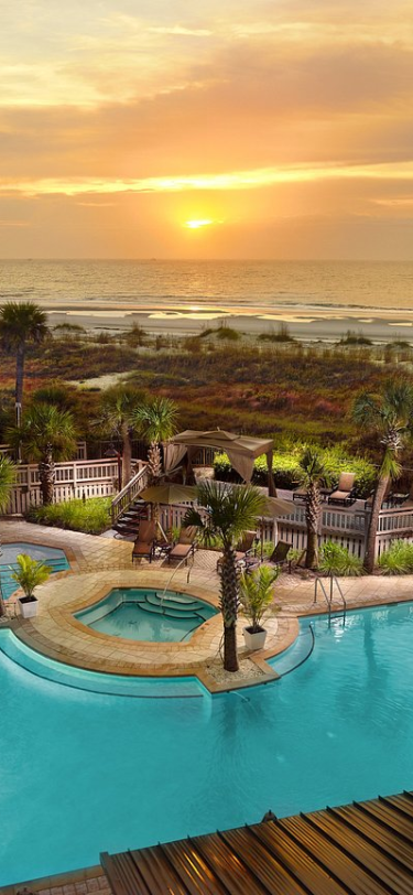 pool with a sunset behind