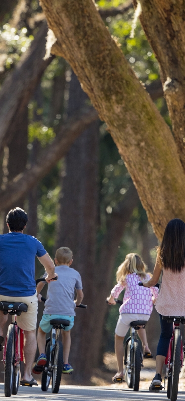 a family biking through trees