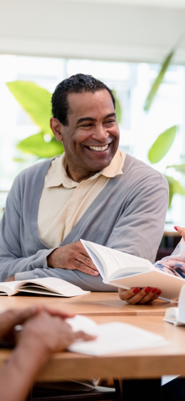 group of people smiling during a meeting