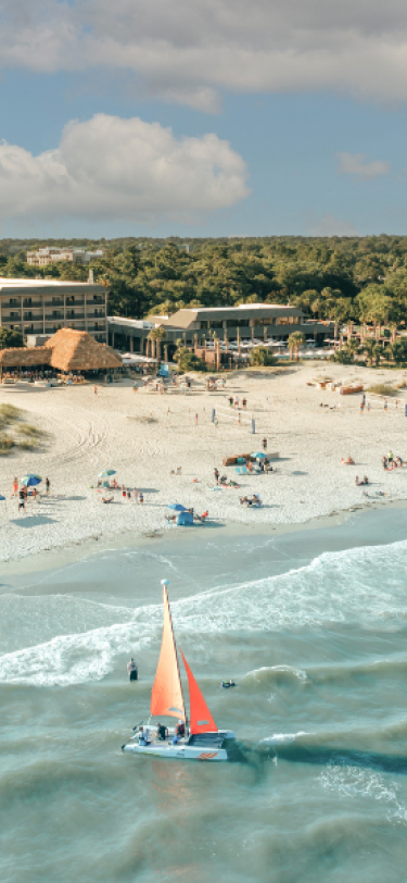 BHHHI Beach and Resort Aerial with Sailboat