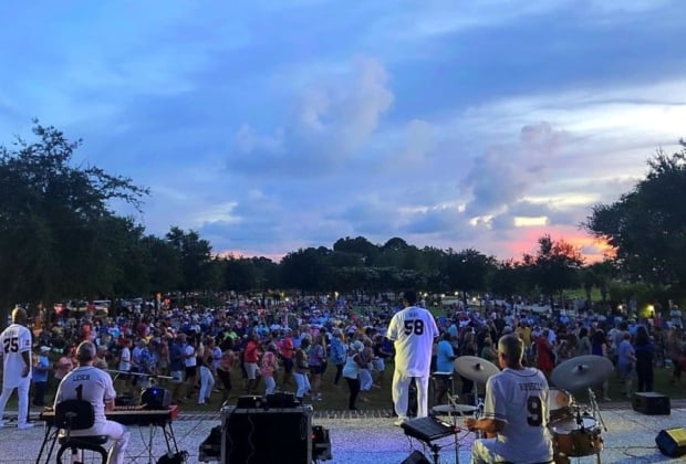 Deas Guyz performing on stage at night to a full live audience