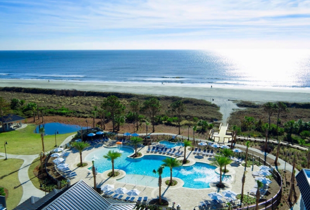 Exterior pool area leading to beach