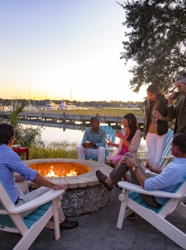 group of people around a firepit
