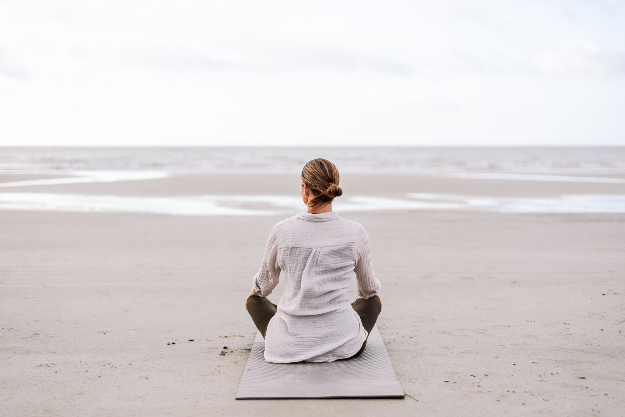 woman sitting on the beach