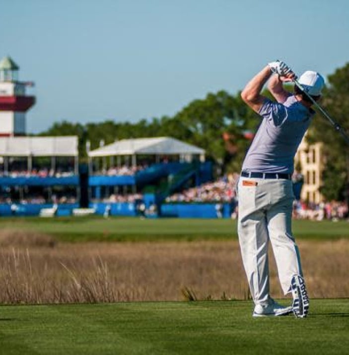 Golfer holds his stance post swing