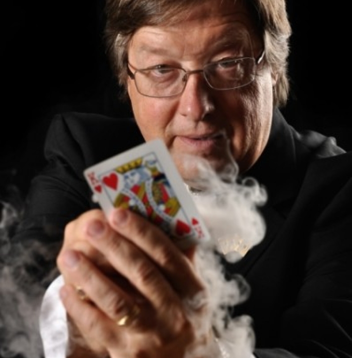 Magician showing his card
