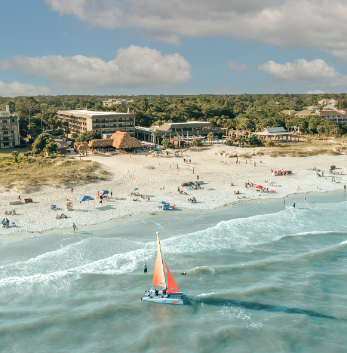 BHHHI Beach and Resort Aerial with Sailboat