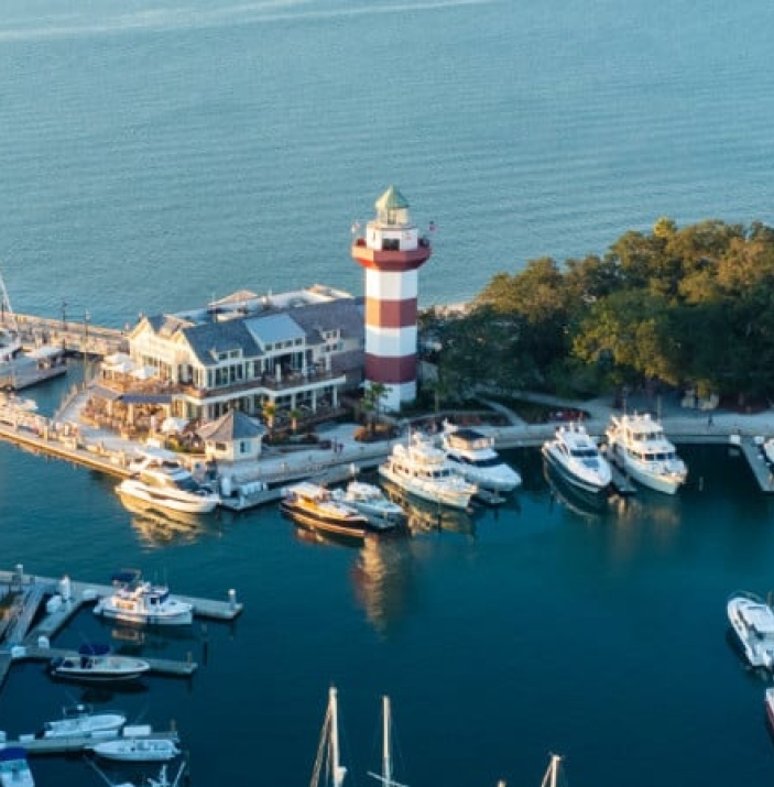 Quarterdeck venue nestled on the water near a lighthouse