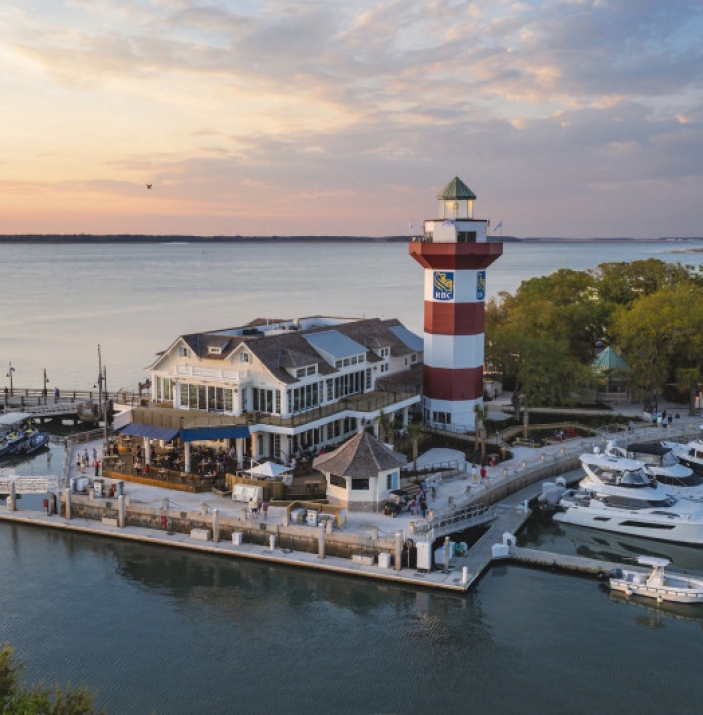 Quarterdeck venue nestled on the water near a lighthouse